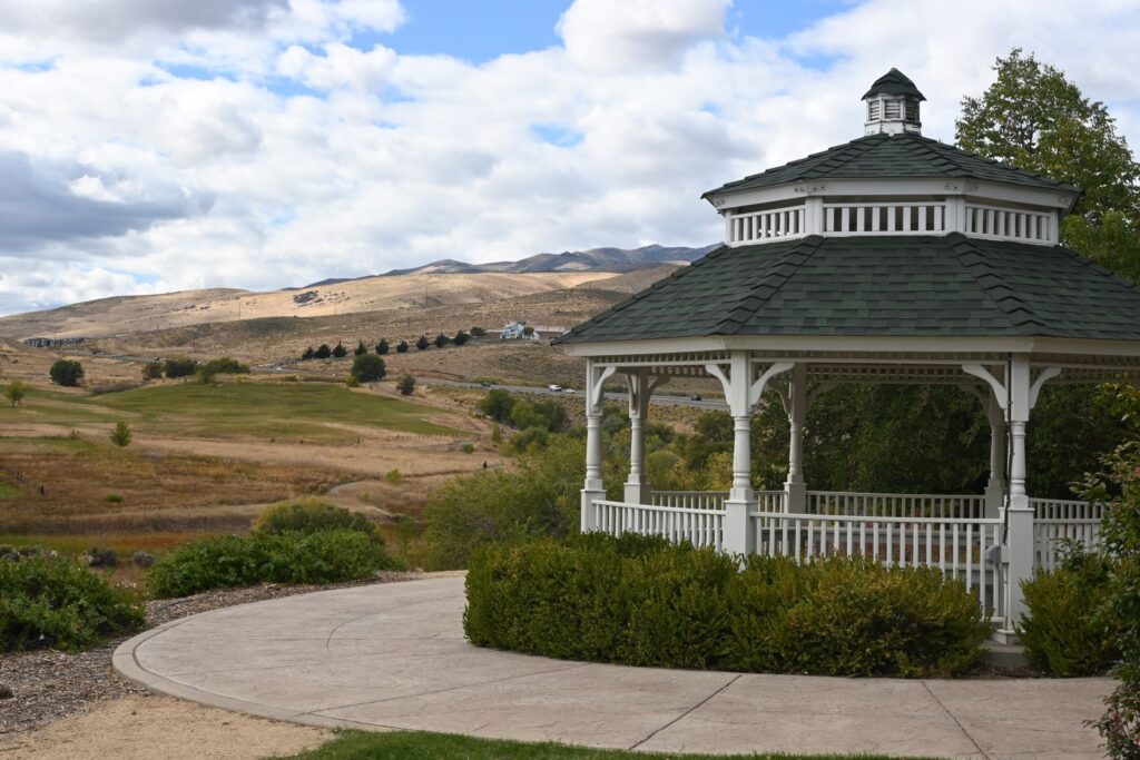 Gazebo is pictured with desert field in distance